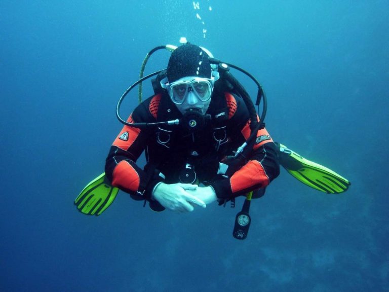 A scuba diver wearing specialty clothing designed for scuba diving.