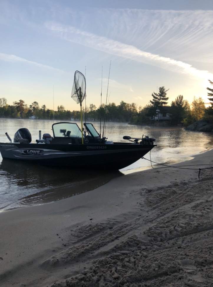 A bass boat driven up onto the beach from shallow water is shown in this file photo